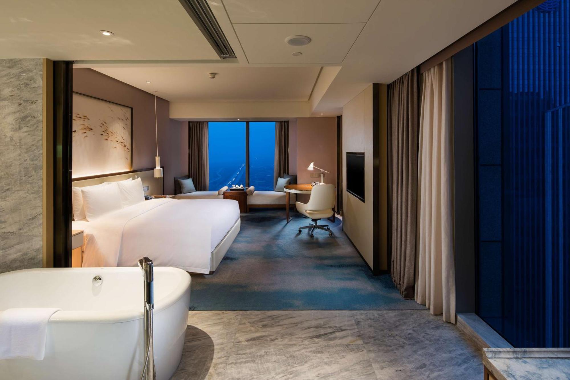 ฮิลตัน ฉวนโจว ริเวอร์ไซด์ Hotel เฉวียนโจว ภายนอก รูปภาพ
